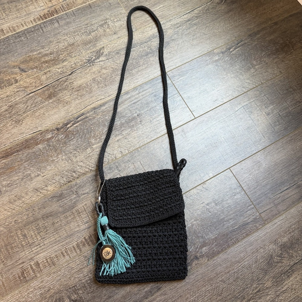 The Sak Black Crochet Crossbody Bag Mini Flap Purse Boho with Teal Tassel Charm